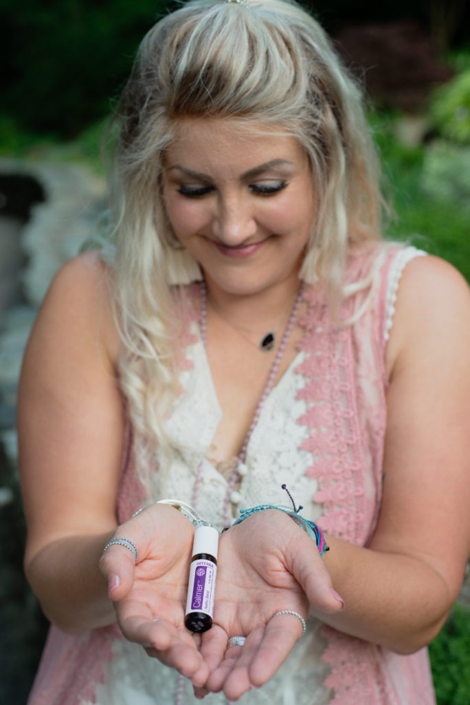 Tracey holding "doTERRA Console Blend", a staple during the emotional healing phase. 
